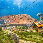 Old town of Dubrovnik with cable car ascending Srd mountain, Dalmatia, Croatia