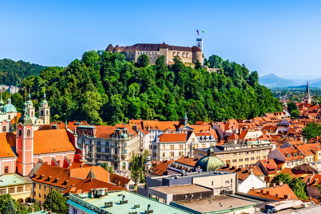 Old town and the medieval Ljubljana castle on top of a forest hill in Ljubljana, Slovenia